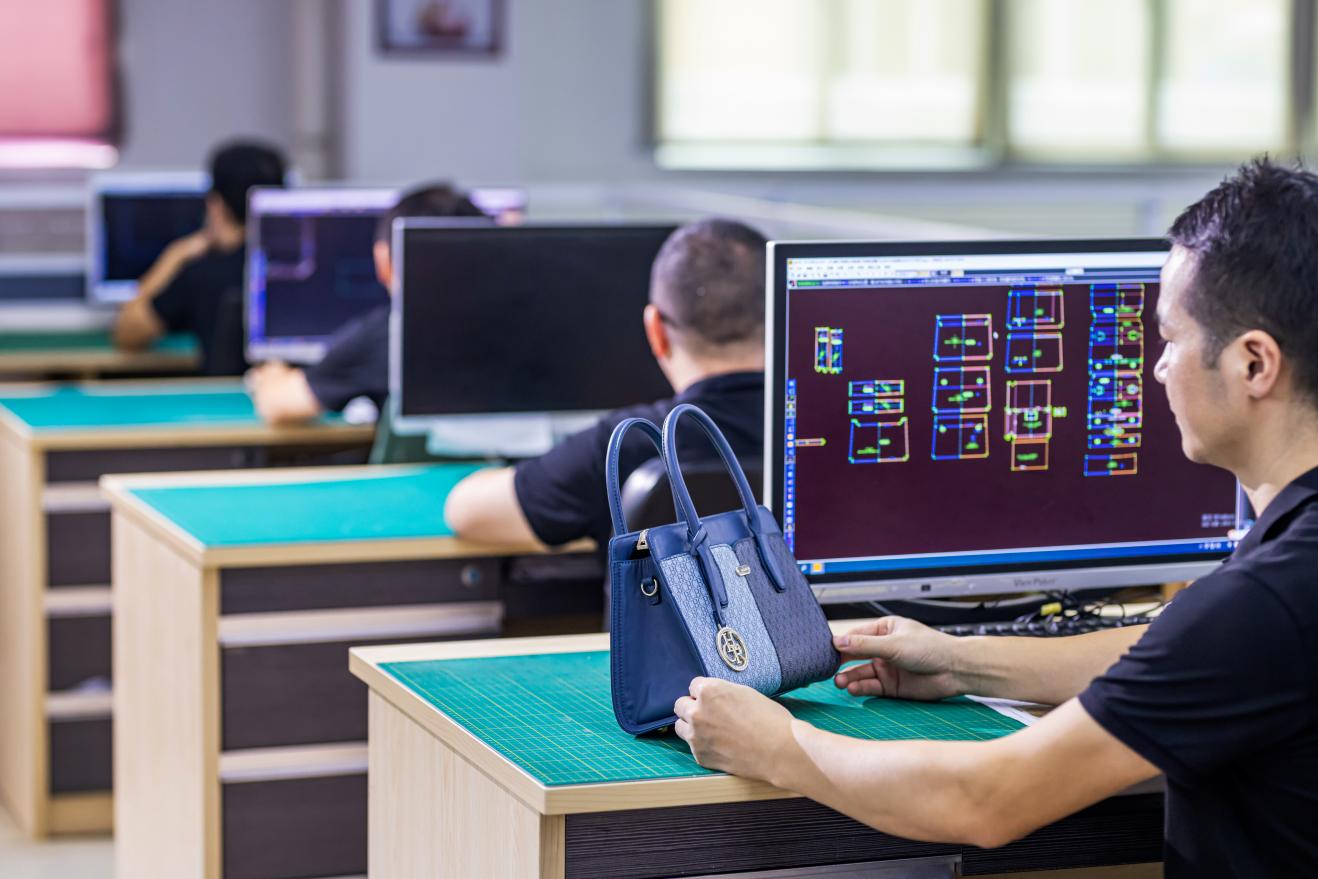 Handbag design team evaluating OEM and ODM product development