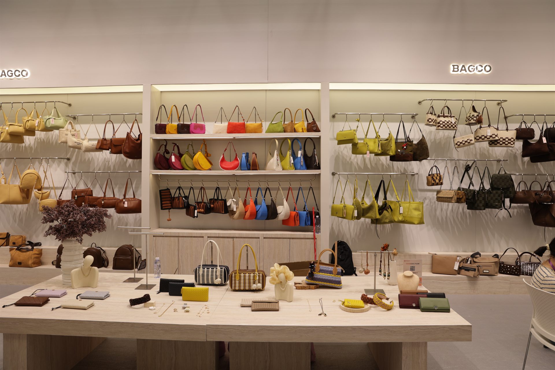 BAGCO and CHRISBELLA handbag collections displayed at a trade exhibition